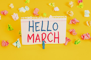 Word writing text Hello March. Business photo showcasing musical composition usually in duple or quadruple with beat Colored crumpled papers empty reminder white floor background clothespin