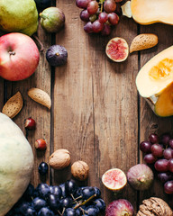 Food frame. Autumn vegetables. Pumpkin, Grapes, Figs