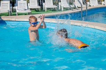 two children in swimming pool