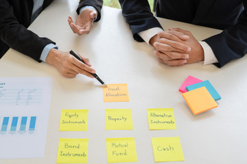 wealth management concept, business man and team analyzing financial statement for planning financial customer case in office.