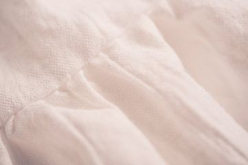 White linen textile closeup. Selecive focus.