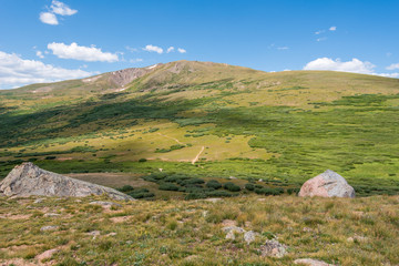 Fototapeta na wymiar Guanella Pass in Colorado landscape with alpine green mountain tops and clouds