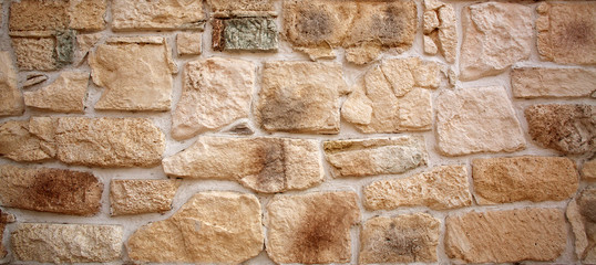 Ancient stone old wall background, antique textured exterior