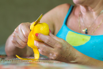 woman with a piece of fruit in her hand, healthy life