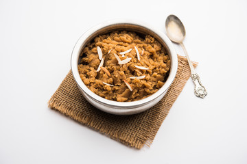Wheat flour Halwa or Shira /  Atte ka Halva, Popular healthy dessert or breakfast menu from India. served in a bowl or plate. selective focus