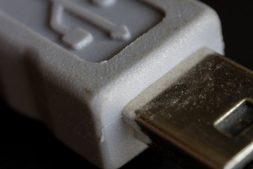 Close up of an Micro B sized of Universal Serial Bus (USB) cable. 