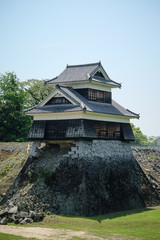 Landscape of historic fortress construction site under maintenance or renovation at Kumamoto Castle.