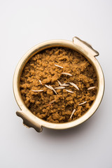 Wheat flour Halwa or Shira /  Atte ka Halva, Popular healthy dessert or breakfast menu from India. served in a bowl or plate. selective focus