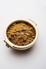 Wheat flour Halwa or Shira /  Atte ka Halva, Popular healthy dessert or breakfast menu from India. served in a bowl or plate. selective focus