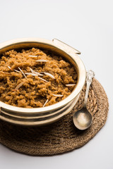 Wheat flour Halwa or Shira /  Atte ka Halva, Popular healthy dessert or breakfast menu from India. served in a bowl or plate. selective focus