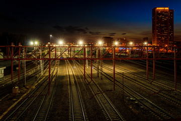 Rail station in the city at night