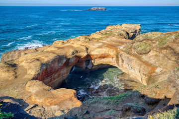 Wide shot of the Devil's Punchbowl on Oregon's central Pacific Coast.  