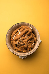 Wheat flour Halwa or Shira or porridge /  Atte ka Halva, Popular healthy dessert or breakfast menu from India. served in a bowl or plate. selective focus