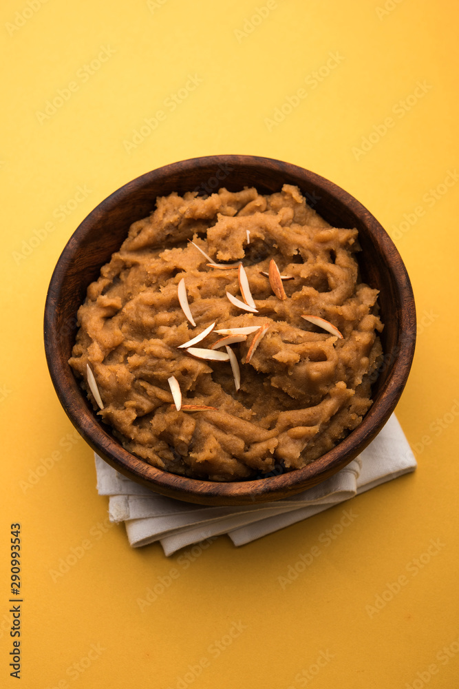 Poster Wheat flour Halwa or Shira or porridge /  Atte ka Halva, Popular healthy dessert or breakfast menu from India. served in a bowl or plate. selective focus