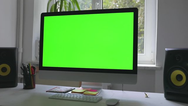 Workplace at loft room with personal computer green screen and chroma key work at home