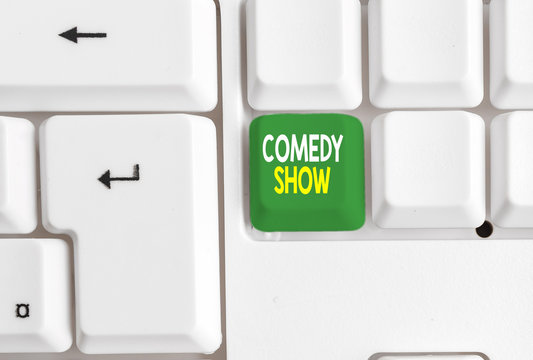 Conceptual hand writing showing Comedy Show. Concept meaning Funny program Humorous Amusing medium of Entertainment White pc keyboard with note paper above the white background