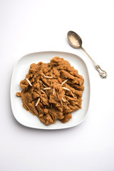 Wheat flour Halwa or Shira or porridge /  Atte ka Halva, Popular healthy dessert or breakfast menu from India. served in a bowl or plate. selective focus
