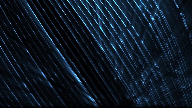Blue digital technology particles on black background (Looping) 