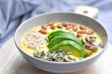 smoothie bowl, mango yogurt with avocado topping