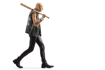 Fototapeta premium Dangerous man in leather clothes walking with a baseball bat