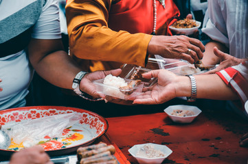 Homeless and needy people receive help, receive food from volunteers : concept of food donation