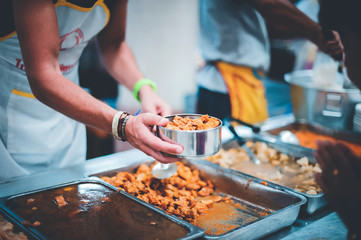 The concept of feeding : The hands of the poor receive food from the hands of the humane : Helping Feed the Poor