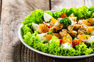 Boiled eggs with roast chicken fillet and vegetables