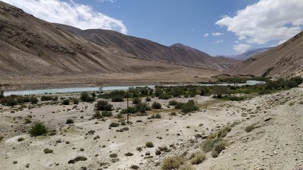 View on Wakhan Corridor in Afghanistan behind the Wakhan river. Taken from Pamir highway on Tajikistan side.