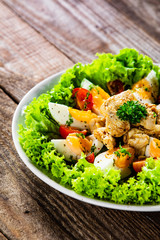 Boiled eggs with roast chicken fillet and vegetables