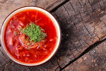 Ukrainian traditional dish borsch on a wooden board