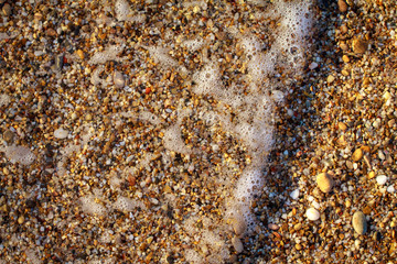 sea pebbles colored granite on the beach