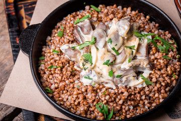 buckwheat porridge in a pan with mushroom seasoning