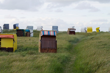 Colorful wooden beach chairs in Cuxhaven (Duhnen), Germany