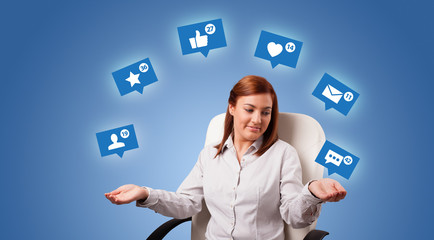 Young person playing with social media symbols