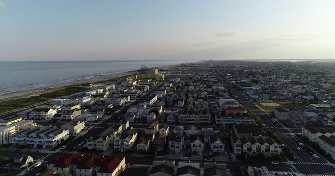 View from aerial drone flying over New Jersey beach town in evening time around sunset Wildwood