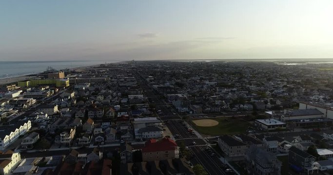 View from aerial drone flying over New Jersey beach town in evening time around sunset Wildwood