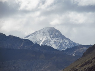 a view of mountains from El Yeso reservoir (Embalse El Yeso), in andes mountain range of Chili