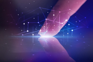 Finger touching tablet with global network concept and dark background