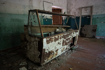 Rusty ice cream chiller / fridge in abandoned building