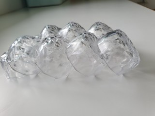 ice cubes in glass on blue background