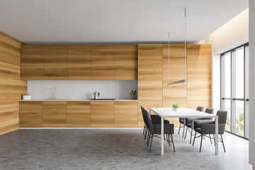 White and wooden kitchen with table