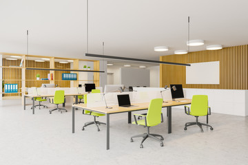Bright wooden open space office with poster