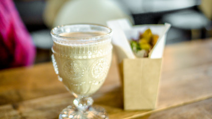 Miniature Arab shwarma with Hummus Greek Salad Olives and Pita Bread with coffee