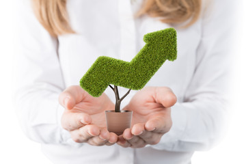 Woman holding arrow shaped plant