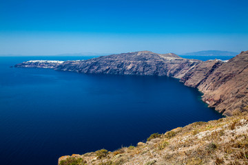 Fototapeta na wymiar The beautiful Aegean Sea seen from the walking trail number 9 which connects the cities of Fira and Oia on the Santorini Island