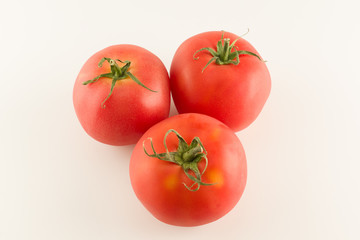 ripe red varietal tomatoes isolated