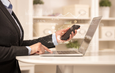 Business woman in homey environment using laptop with financial report concept