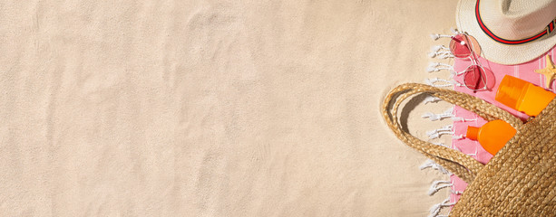 Composition with beach accessories and space for text on sand, flat lay