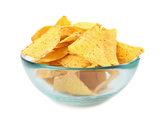 Glass bowl with tasty Mexican nachos chips on white background