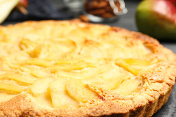 Delicious sweet pear tart on table, closeup
